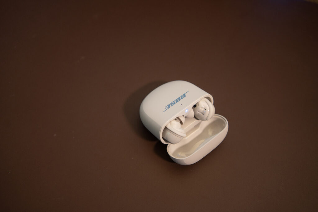 Bose QuietComfort Ultra Earbuds 2 Bose QuietComfort Ultra Earbuds 2 sitting on a desk
