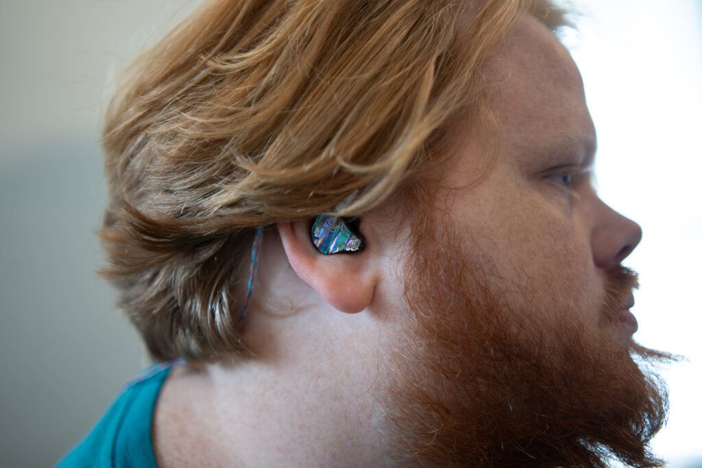 HiFiGo Juzear IEM earphones in a man's ears