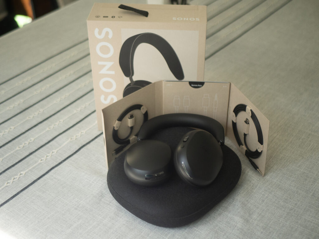 Sonos Ace Review: headphones sitting on table with all accessories and box